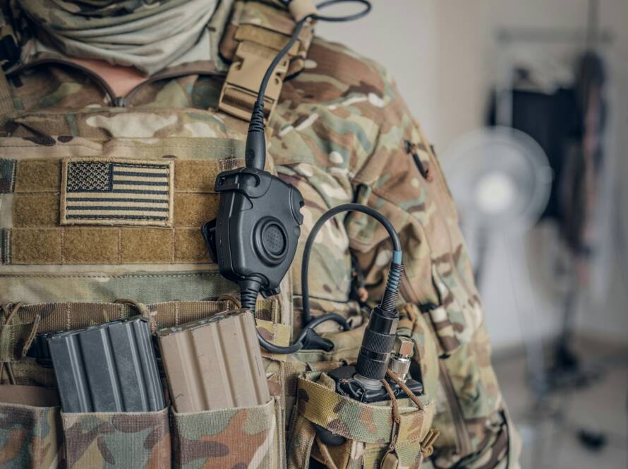 Military man with radio in pocket