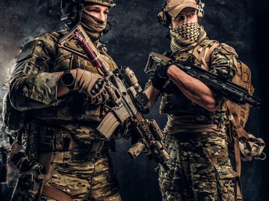 Two special forces soldiers in full protective equipment with assault rifles